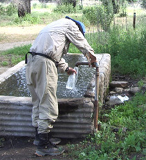 Bill collects Barrel Springs water